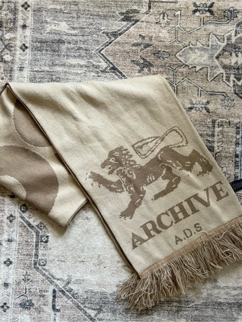 ASOS DESIGN knit Archive graphic scarf in neutral lion